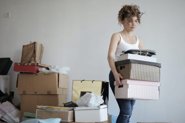 Woman decluttering inventory.