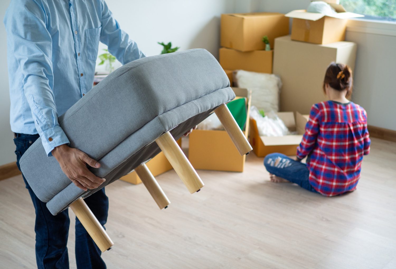 people moving heavy furniture